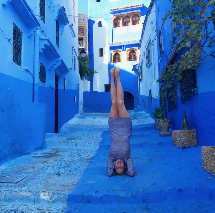 Ryen Toft headstand on a blue painted street
